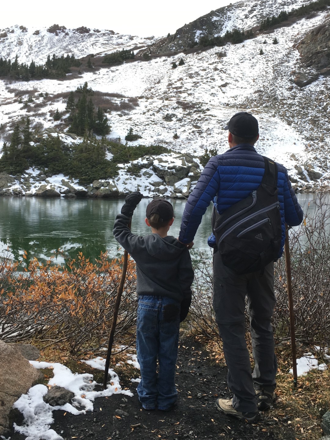 A father and son take in the views near Spring Canyon during Climb Together
