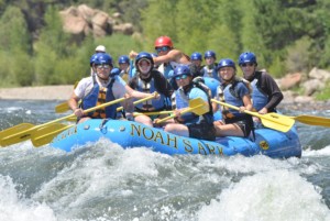 Copy of 4672531 Father Teen Adventure members raft on the Arkansas river.