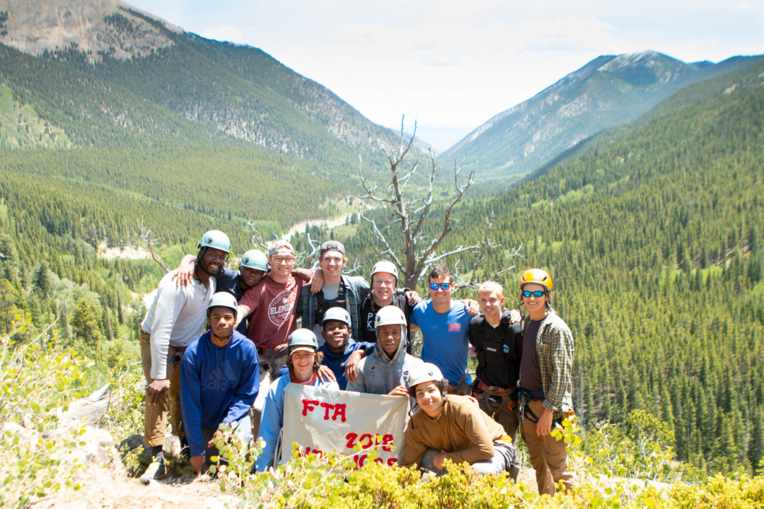 Father Teen Adventure men pose in front of Cottonwood pass.