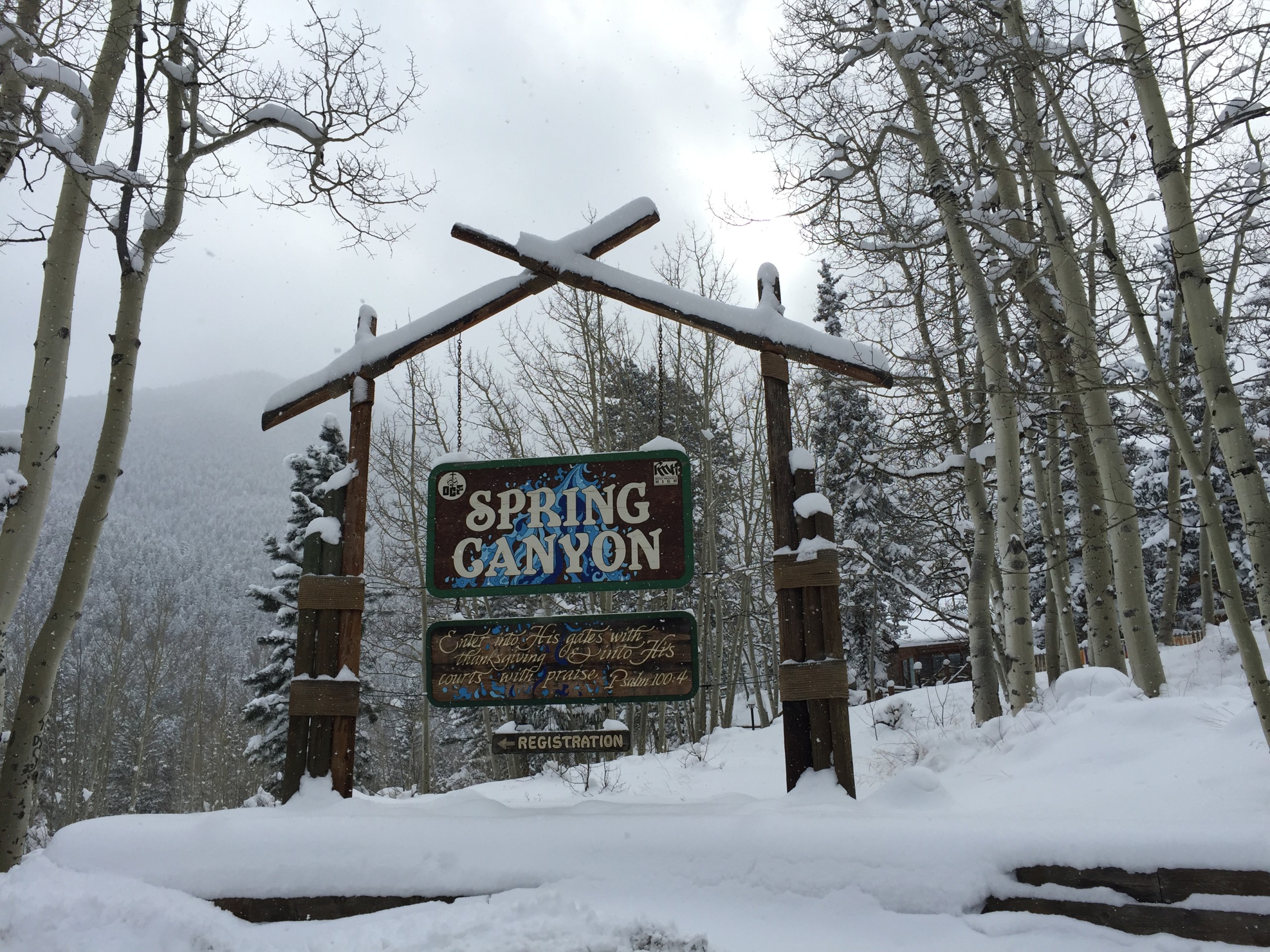 Sign at Spring Canyon entrance, covered in snow