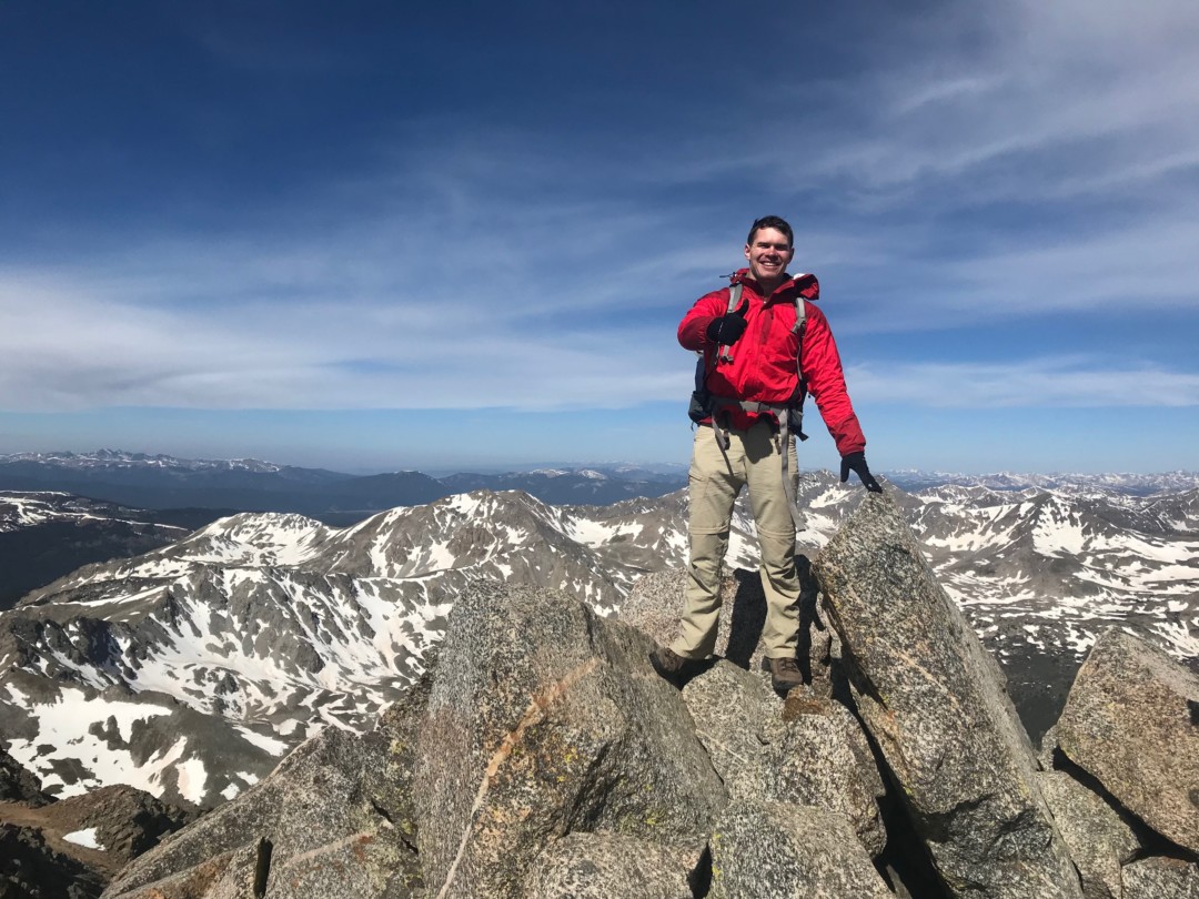 USNA cadet on top of Mount Harvard